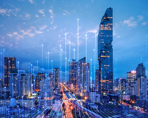 A city skyline at dusk with modern graphics