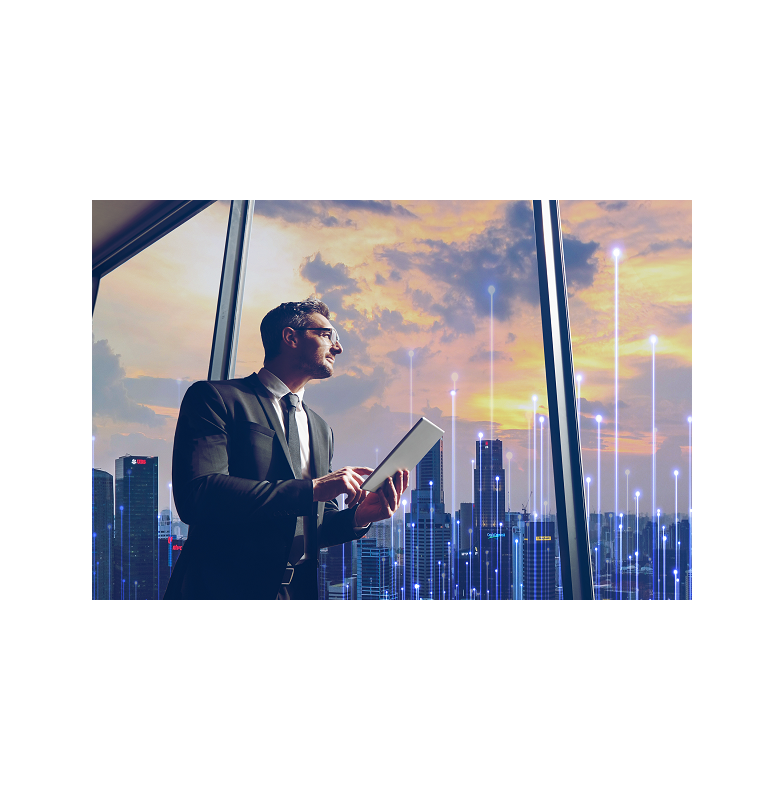 Man standing next to a window holding a tablet with modern graphics