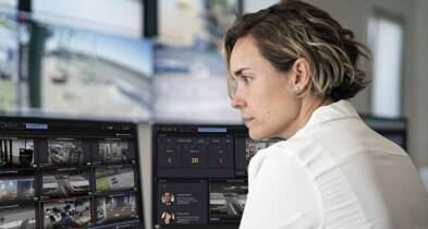 Side profile of a woman reviewing surveillance videos
